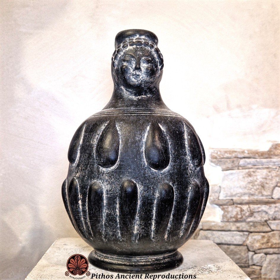 Oinochoe bucchero volto donna